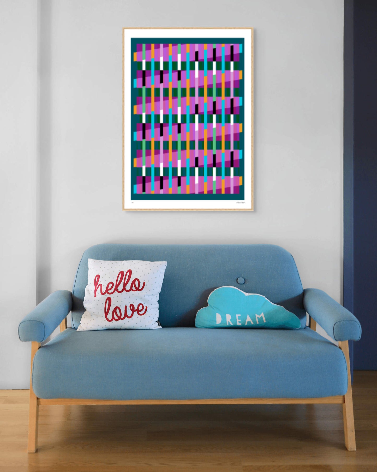 Turquoise geometric abstract giclée print by Victoria Mardon in an oak frame displayed above a blue mid-century sofa
