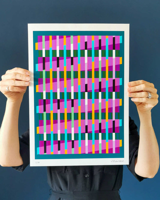 Turquoise geometric abstract giclée print by Victoria Mardon held in hands against a dark background