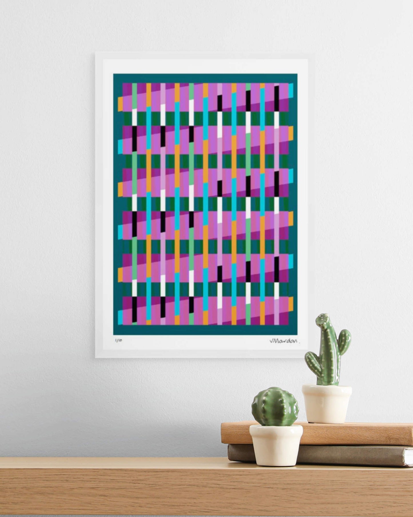 A3 white-framed geometric abstract giclée print by Victoria Mardon displayed on a white wall above an oak shelf