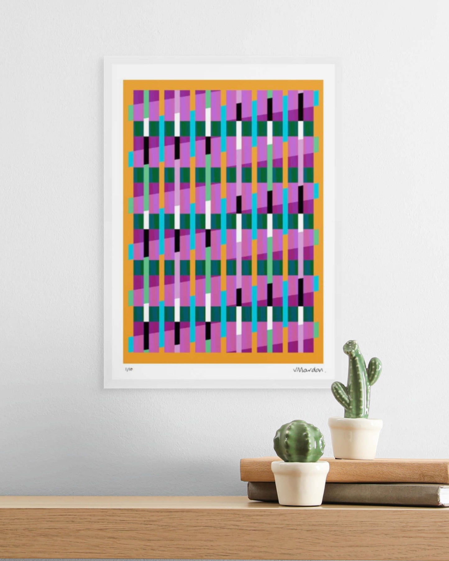 A3 white-framed geometric abstract giclée print by Victoria Mardon displayed on a white wall above an oak shelf