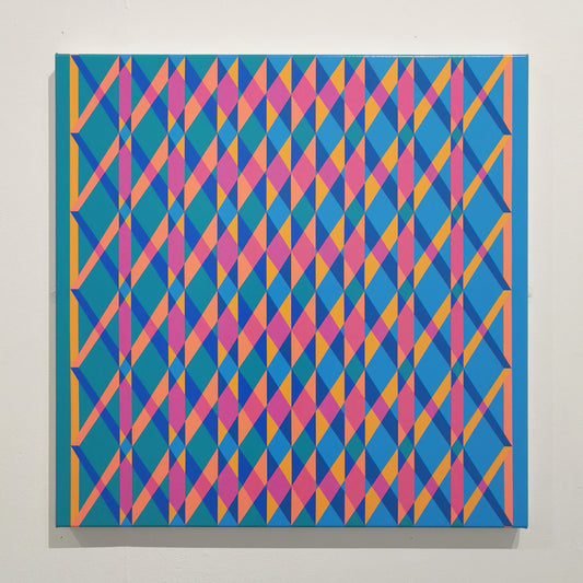 Geometric patterned artwork on a white wall