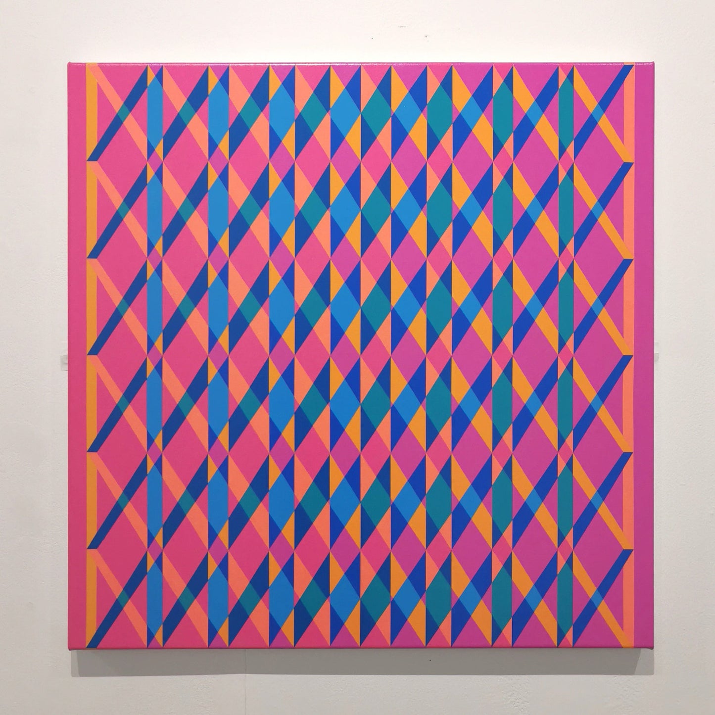 Abstract geometric pattern with pink and blue colors on a white background